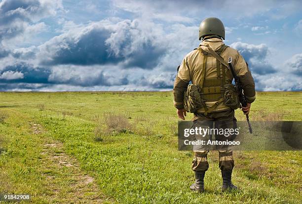 the lonely soldier - kalashnikov stock pictures, royalty-free photos & images