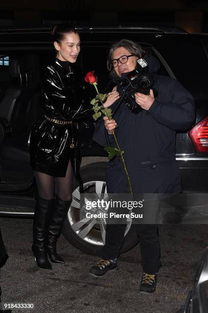 Bella Hadid poses with the paparazzis outside Mr Chow restaurant where she had Valentine's Day dinner with her mother on February 14, 2018 in New...
