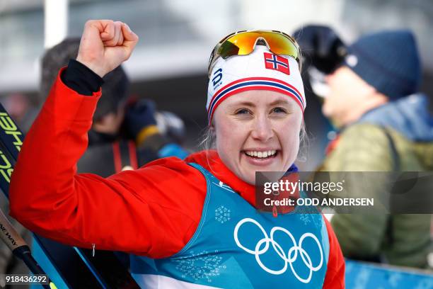 Norway's Ragnhild Haga celebrates winning gold at the end of the women's 10km freestyle cross-country competition at the Alpensia cross country ski...