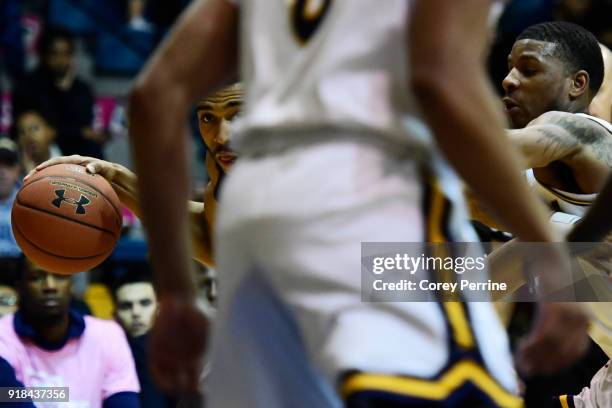 Courtney Stockard of the St. Bonaventure Bonnies is guarded by Amar Stukes of the La Salle Explorers during the first half at Tom Gola Arena on...