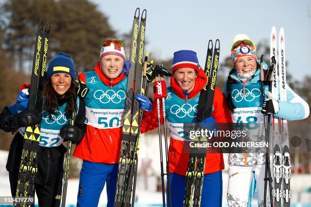 Silver medallist Sweden's Charlotte Kalla, gold medallist Norway's Ragnhild Haga, and joint bronze winners Norway's Marit Bjorgen and Finland's...