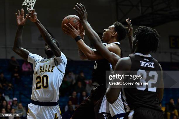 Jaylen Adams of the St. Bonaventure Bonnies drives to the basket against B.J. Johnson of the La Salle Explorers during the first half at Tom Gola...