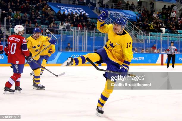 Par Lindholm of Sweden celebrates after scoring the opening goal during the Men's Ice Hockey Preliminary Round Group C game between Norway and Sweden...