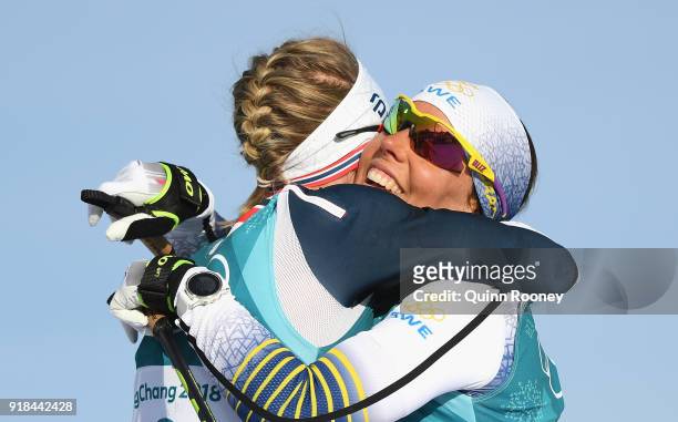 Ragnhild Haga of Norway celebrates with Charlotte Kalla of Sweden following the Cross-Country Skiing Ladies' 10 km Free on day six of the PyeongChang...