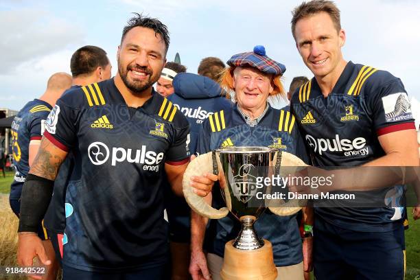 Co Captains Ash Dixon Fred Booth and Ben Smith of the Highlanders pose for a photo with the Farmlands Cup after defeating the Crusaders in the Super...