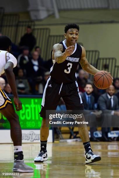 Jaylen Adams of the St. Bonaventure Bonnies dribbles against B.J. Johnson of the La Salle Explorers while calling to his teammates during the first...