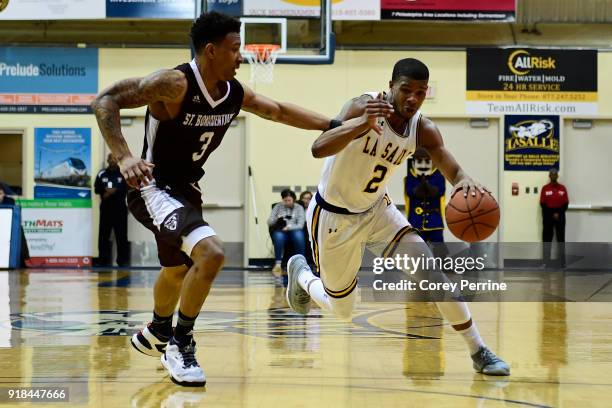 Jaylen Adams of the St. Bonaventure Bonnies pressures Amar Stukes of the La Salle Explorers as he dribbles during the second half at Tom Gola Arena...