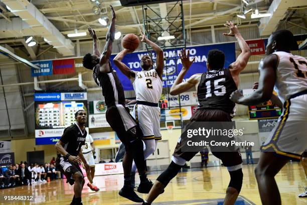 Amar Stukes of the La Salle Explorers drives to the basket against Matt Mobley of the St. Bonaventure Bonnies during the second half at Tom Gola...