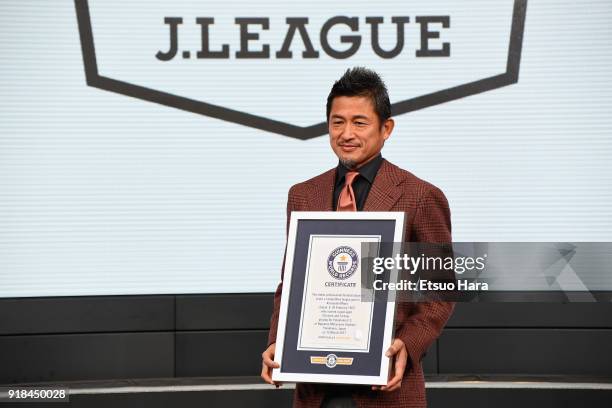 Kazuyoshi Miura poses for photographs with the Guinness World Record certificate as he is recognised as the 'Oldest professional football player to...