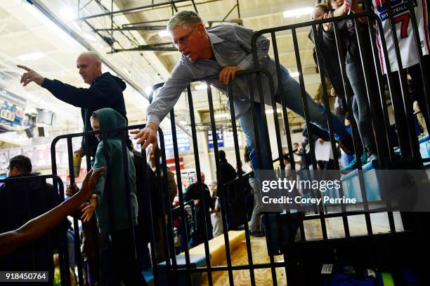 St. Bonaventure Bonnies fan high-fives teammates after the win over the La Salle Explorers at Tom Gola Arena on February 13, 2018 in Philadelphia,...