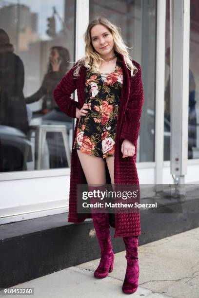 Guest is seen on the street attending Leanne Marshall during New York Fashion Week wearing a burgundy coat and boots with floral dress on February...
