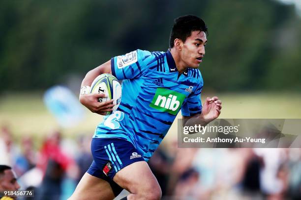 Rieko Ioane of the Blues makes a break during the Super Rugby trial match between the Blues and the Hurricanes at Mahurangi Rugby Club on February...