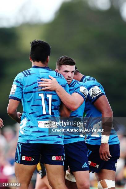 Bryn Gatland of the Blues congratulates teammate Rieko Ioane on his try during the Super Rugby trial match between the Blues and the Hurricanes at...