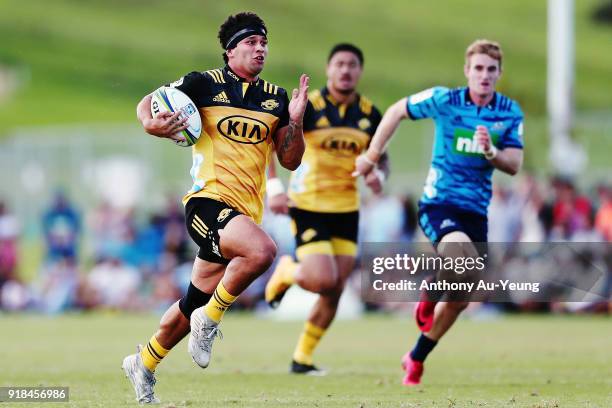 Jonah Lowe of the Hurricanes makes a break during the Super Rugby trial match between the Blues and the Hurricanes at Mahurangi Rugby Club on...