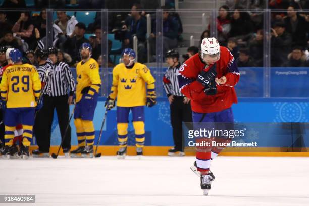 Kristian Forsberg of Norway leaves the ice with a bloody nose during the Men's Ice Hockey Preliminary Round Group C game between Norway and Sweden on...
