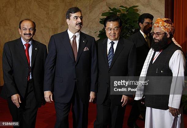 China's President Hu Jintao greets Pakistani Prime Minister Yousuf Raza Gilani prior to their talks at the Great Hall of the People on October 13 in...