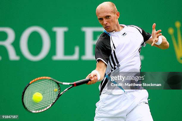 Nikolay Davydenko of Russia returns a shot to Igor Kunitsyn of Russia during their Round two match on day three of the 2009 Shanghai ATP Masters 1000...