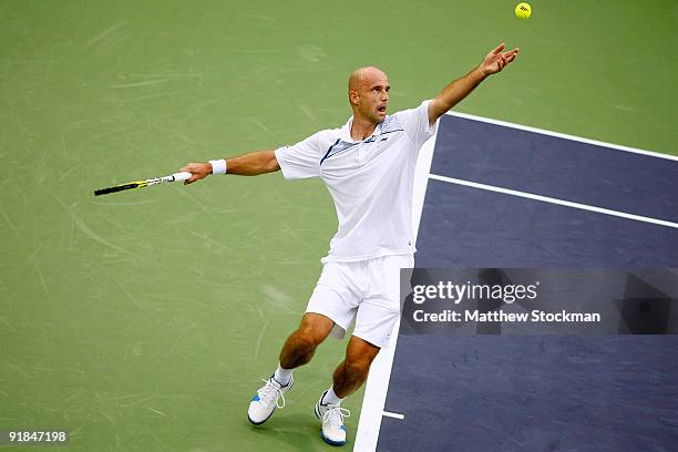 Ivan Ljubicic of Croatia serves to Julien Benneteau of France during their Round one match on day three of the 2009 Shanghai ATP Masters 1000 at Qi...