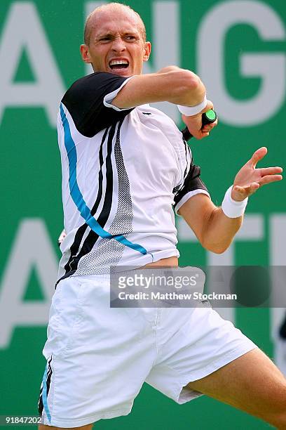 Nikolay Davydenko of Russia returns a shot to Igor Kunitsyn of Russia during their Round two match on day three of the 2009 Shanghai ATP Masters 1000...