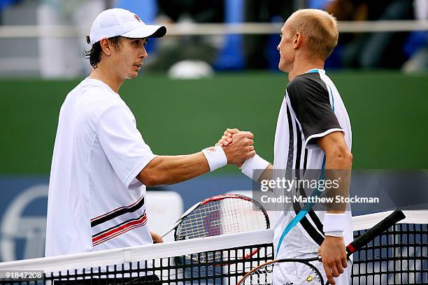 Igor Kunitsyn of Russia congratulates Nikolay Davydenko of Russia after their Round two match on day three of the 2009 Shanghai ATP Masters 1000 at...