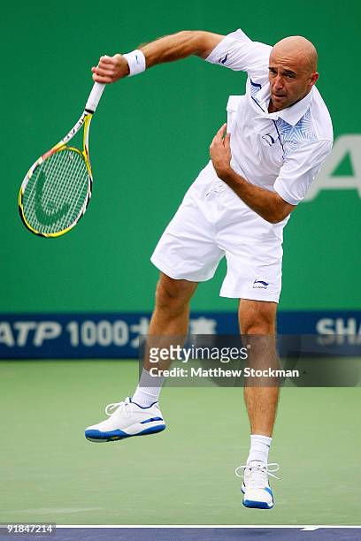 Ivan Ljubicic of Croatia serves to Julien Benneteau of France during their Round one match on day three of the 2009 Shanghai ATP Masters 1000 at Qi...