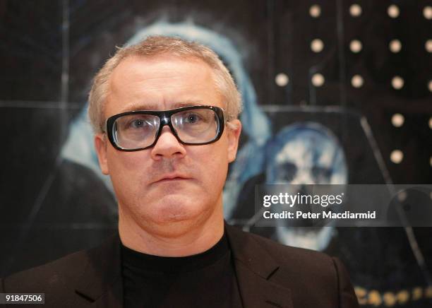 Artist Damien Hirst stands in The Wallace Collection at his 'No Love Lost, Blue Paintings by Damien Hirst' exhibition on October 13, 2009 in London....