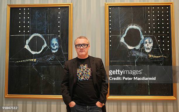 Artist Damien Hirst stands in The Wallace Collection at his 'No Love Lost, Blue Paintings by Damien Hirst' exhibition on October 13, 2009 in London....