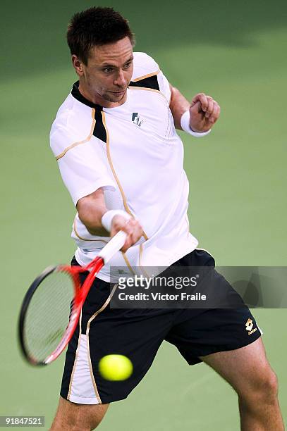 Robin Soderling of Sweden retuns a shot to Victor Hanescu of Romania during their Round one match on day three of the 2009 Shanghai ATP Masters 1000...