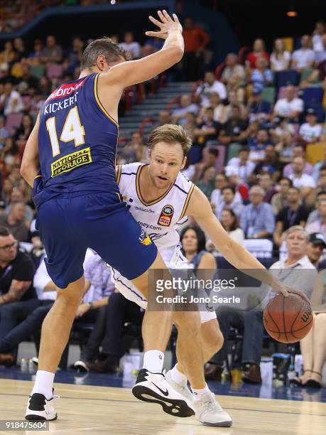 Sydney player Brad Newley tries to get past Brisbane Player Daniel Kickert during the round 19 NBL match between the Brisbane Bullets and the Sydney...