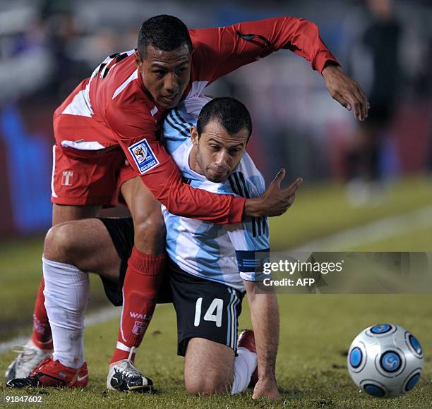 Argentina's footballer Javier Mascherano vies for the ball with Peru's footballer Luis Ramirez during their FIFA World Cup South Africa-2010...