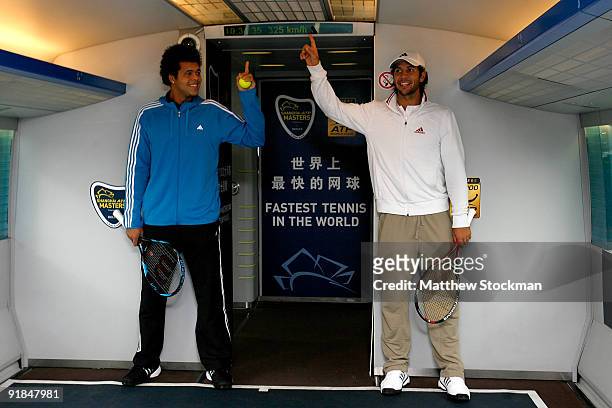 Jo-Wilfried Tsonga of France and Fernando Verdasco of Spain pose for photographers after embarking on 'The Fastest Tennis in the World' aboard the...