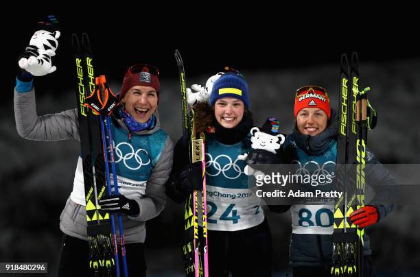 Gold medallist Hanna Oeberg of Sweden poses with silver medalist Anastasiya Kuzmina of Slovakia and bronze medallist Laura Dahlmeier of Germany...