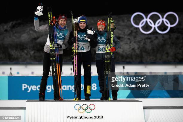 Gold medallist Hanna Oeberg of Sweden poses with silver medalist Anastasiya Kuzmina of Slovakia and bronze medallist Laura Dahlmeier of Germany...