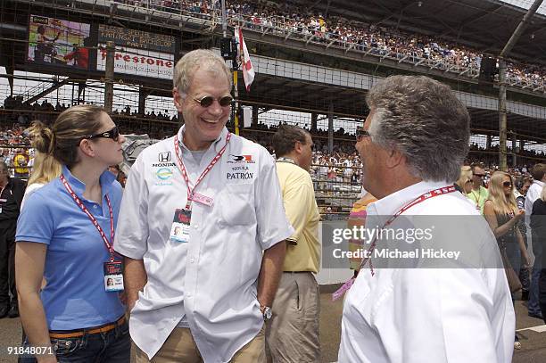 David Letterman, with assistant Stephanie Birkitt, talks to Mario Andretti before the start of the Indy 500 on May 27, 2007 in Speedway, Indiana.