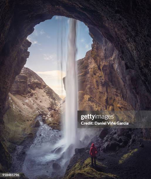 hiker at majestic kvernufoss waterfall in iceland - skogafoss waterfall stock pictures, royalty-free photos & images