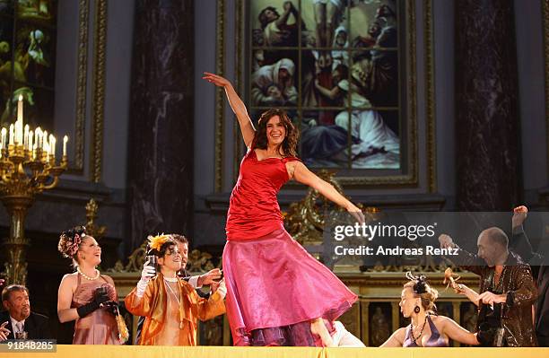 Katarina Witt performs on stage during the 'Jedermann' dress rehearsal at the Berlin Cathedral Church on October 13, 2009 in Berlin, Germany.