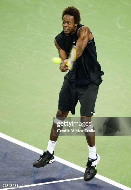 Gael Monfils of France returns a shot to his compatriot Paul-Henri Mathieu on day three of 2009 Shanghai ATP Masters 1000 at the Qi Zhong Tennis...