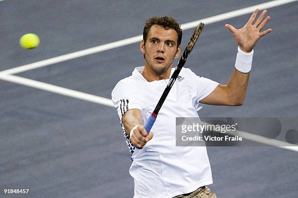 Paul-Henri Mathieu of France returns a shot to his compatriot Gael Monfils on day three of 2009 Shanghai ATP Masters 1000 at the Qi Zhong Tennis...