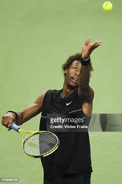 Gael Monfils of France serves to his compatriot Paul-Henri Mathieu on day three of 2009 Shanghai ATP Masters 1000 at the Qi Zhong Tennis Centre in...