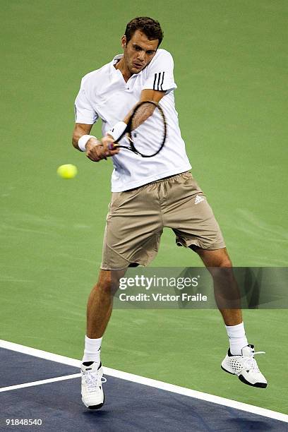 Paul-Henri Mathieu of France returns a shot to his compatriot Gael Monfils on day three of 2009 Shanghai ATP Masters 1000 at the Qi Zhong Tennis...