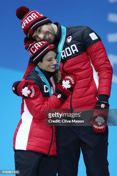 Bronze medalists Meagan Duhamel and Eric Radford of Canada celebrate during the medal ceremony for the Pair Skating Free Skating on day six of the...