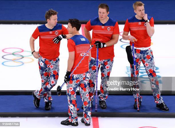 Torger Nergaard, Thomas Ulsrud, Christoffer Svae and Haavard Vad Petersson of Norway wait to play in a 7-4 loss to Canada during the Men's Curling...