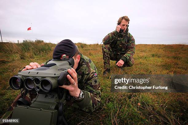 Forward Air Controller Corporal Craig Pullen and Captain Paul McPherson guide in fighter jets to a target as they take part in exercise Joint...