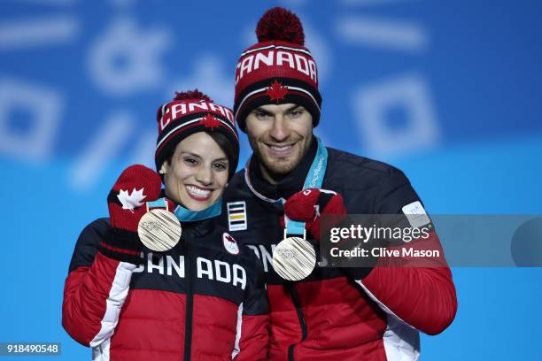 Bronze medalists Meagan Duhamel and Eric Radford of Canada celebrate during the medal ceremony for the Pair Skating Free Skating on day six of the...