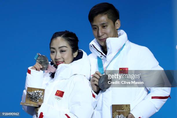 Silver medalists Wenjing Sui and Cong Han of China celebrate during the medal ceremony for the Pair Skating Free Skating on day six of the...