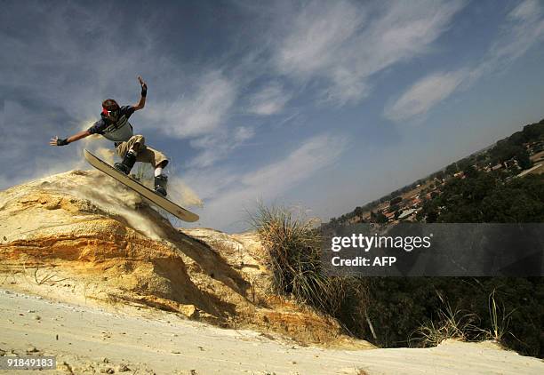 Surfer performs a stunt on September 19, 2009 at one of the abandoned gold mines in Boksburg, east of Johannesburg. South Africa's biggest city lies...