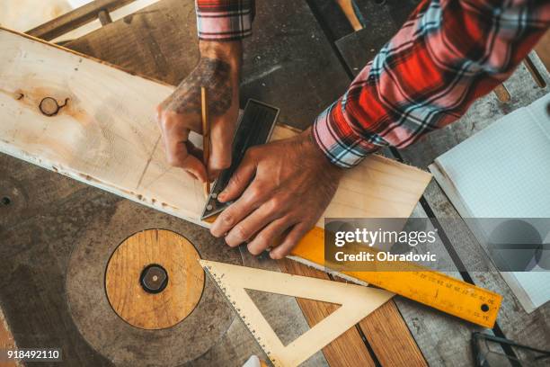 carpenter measuring a wooden plank - diy top view stock pictures, royalty-free photos & images