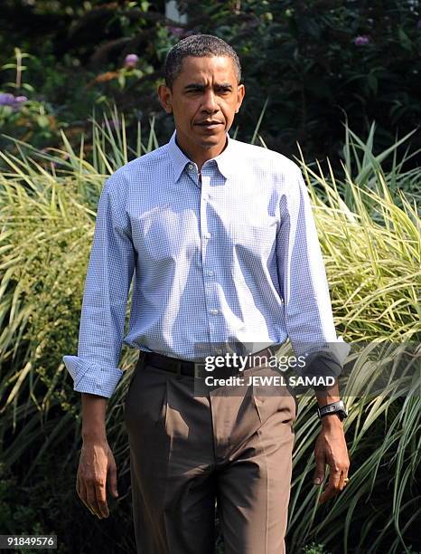 President Barack Obama walks to make a statement over the death of US Senator Edward Kennedy at the Blue Heron Farm in Oak Bluffs on Martha's...