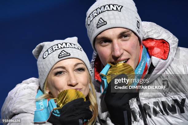 Germany's gold medallists Aljona Savchenko and Bruno Massot pose on the podium during the medal ceremony for the figure skating pair event at the...