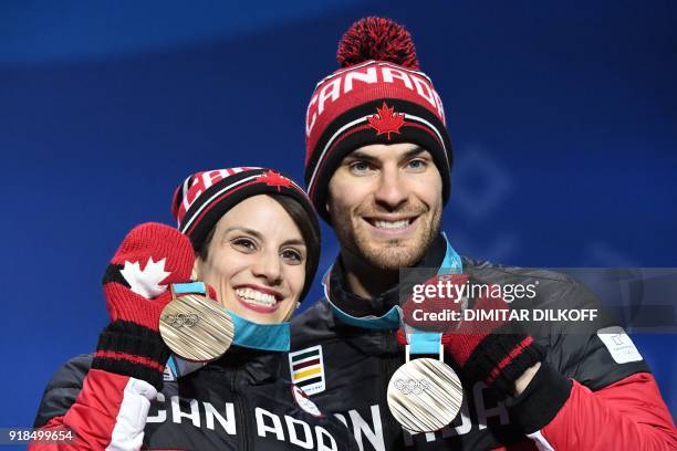 Canada's bronze medallists Meagan Duhamel and Eric Radford pose on the podium during the medal ceremony for the figure skating pair event at the...